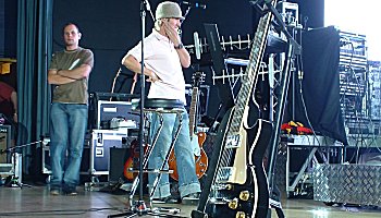 Jon and Martin standing at the side of the stage