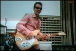 Video still: Martin on the roof with his guitar