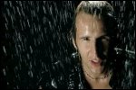 Video still: Martin singing in the rain