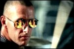 Video still: Fire reflected in Stew's glasses