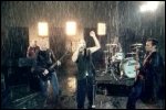 Video still: Performing in the rain