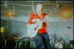 Video still: Stu and the band performing