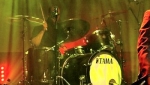 Who's that mystery man hiding behind the drums?
