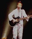 Martin singing whilst playing guitar