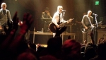 Peering through the crowd at the band on stage