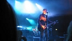 Martin with guitar under the bright lights