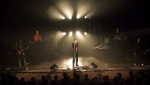 The crowd watch as the band perform on stage