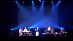 Blue light beams over the band