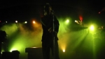 Martin silhouetted on stage bathed in yellow